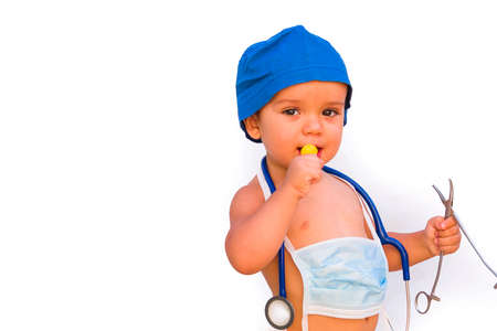 child dressed as a doctor. doctor-surgeon costume.の写真素材