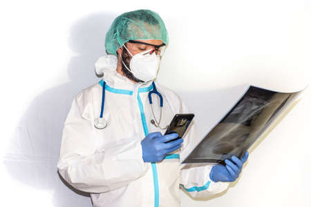 doctor with protective suit for covid19 with laboratory equipment. White background.の写真素材