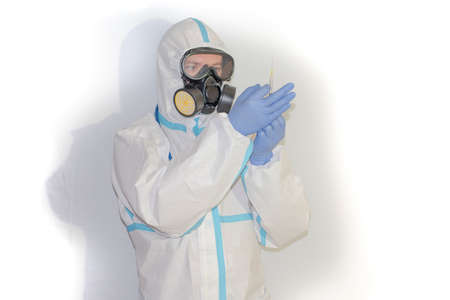 doctor with protective suit for covid19 with laboratory equipment. White background.の写真素材