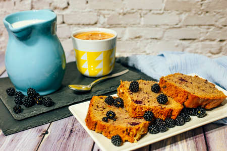 Still life of wild fruit cake with cup of milk with cocoa and milk jug.の写真素材