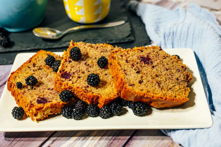 Still life of wild fruit cake with cup of milk with cocoa and milk jug.の写真素材