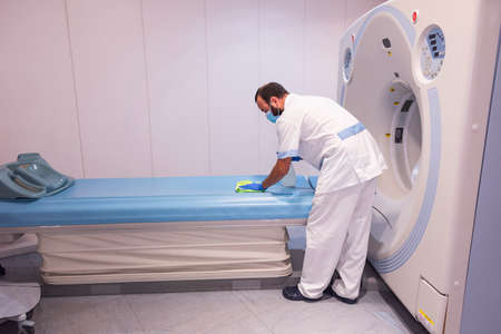 cleaning staff performing disinfection and hygiene work in hospital facilitiesの写真素材