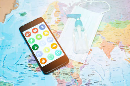 Madrid, Spain 10/2020 mobile phone with the main social media with a world map backgroundのeditorial素材