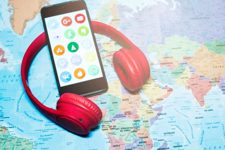 Madrid, Spain 10/2020 mobile phone with the main social media with a world map backgroundのeditorial素材