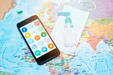 Madrid, Spain 10/2020 mobile phone with the main social media with a world map backgroundのeditorial素材