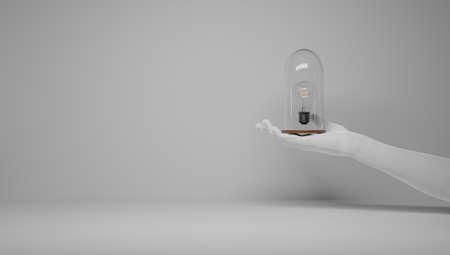 Hands protecting an idea. I have an idea and I want to protect it. Patenting an idea. Eureka, I have an idea. Light bulb symbol related to an idea.の写真素材