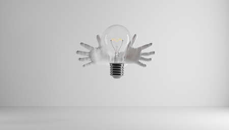 Hands protecting an idea. I have an idea and I want to protect it. Patenting an idea. Eureka, I have an idea. Light bulb symbol related to an idea.の写真素材