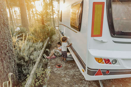 Two Boys In A Caravan playing in the natureの写真素材