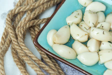 Typical Spanish appetizer tapa composed of garlic in vinaigrette with red wine.の写真素材