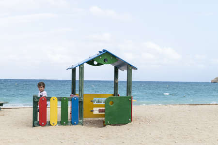 Little toddler boy playind with sandの写真素材