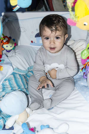 Little Caucasian boy resting smiling at the camera.の写真素材