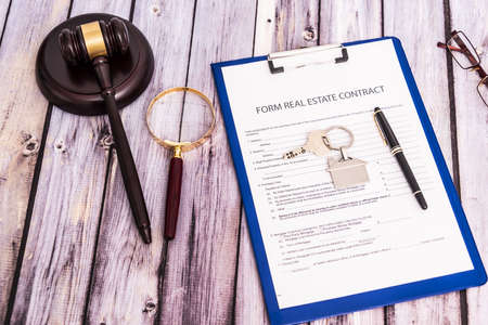 Form for the purchase and sale of real estate. Sample of the signature of the contract for the purchase of property.の写真素材