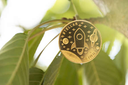 Stellar digital crypto currency. Stack of silver coins. Cyber money.の写真素材
