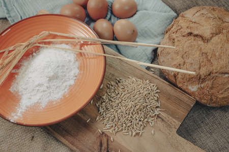 Bread dough with eggs and ingredients to make traditional rustic bread.の写真素材