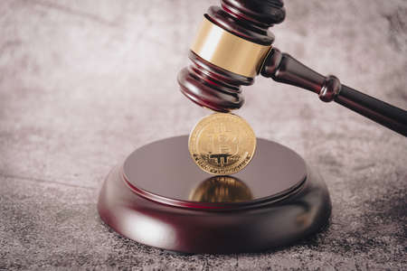 Representative cryptocurrency under the judges gavel in the foreground.の写真素材