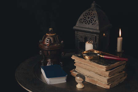 Table prepared for a tarot card reading. Mystery and futurology night.の写真素材