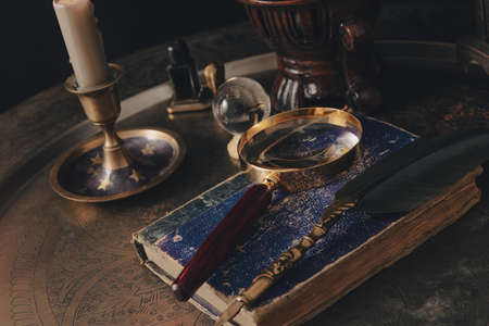 Table prepared for a tarot card reading. Mystery and futurology night.の写真素材