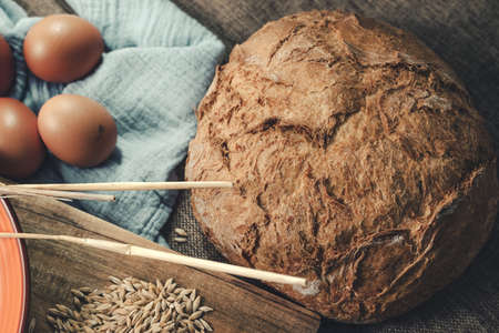 Ingredients for the preparation of the bread on a rustic tablecloth.の写真素材