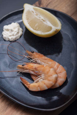 Roasted tails of shrimps with fresh rosemary and lemon.の写真素材