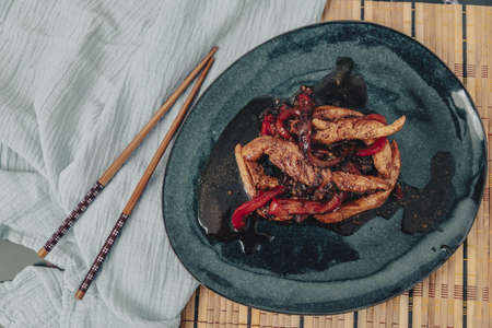 Chicken in soy sauce with red peppers, with pomegranate desserts.の写真素材