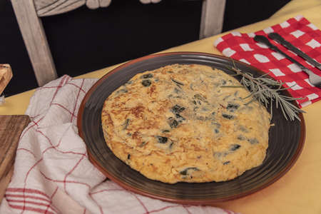 A sliced portion of Zucchini quiche on a plate.の写真素材
