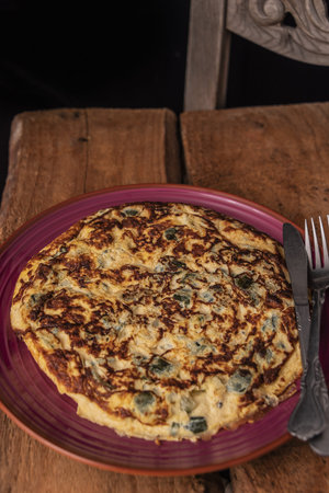A sliced portion of Zucchini quiche on a plate.の写真素材