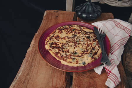 A sliced portion of Zucchini quiche on a plate.の写真素材