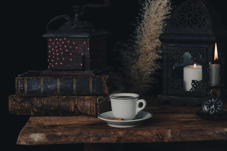 Fortune telling on coffee grounds by candlelight.の写真素材