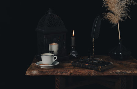 Fortune telling on coffee grounds by candlelight.の写真素材