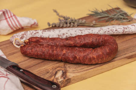 assorted typical spanish iberian sausages on a rustic table.の写真素材