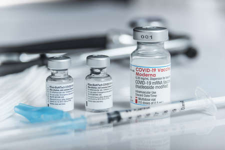 Madrid, Spain -10 December 2021: Approval of third COVID19 booster dose of Pfizer-Biontech and MODERNA vaccines for increased protection against OMICRON variant.のeditorial素材