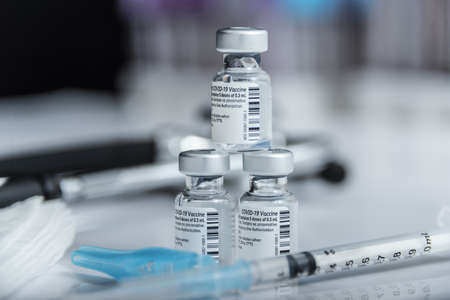 Madrid, Spain -10 December 2021: Approval of the third booster dose of coronavirus vaccines to increase protection against the OMICRON variant.のeditorial素材