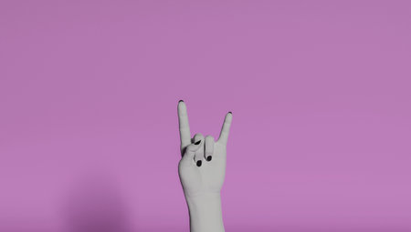 Goat gesture on a pink background. Black hand doing rock symbol. Hands up at a rock concert. Music star. Heavy metal concept. Black metal.の写真素材
