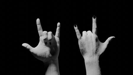 Rock gesture in black background. 3d rendering.の写真素材