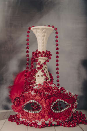 female carnival mask with glittering background whith shadows.の写真素材
