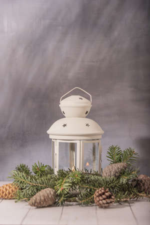 Composition of the Christmas decorations . Bright ornaments, hand lantern and spruce branches isolated on white background. Wide photo.の写真素材