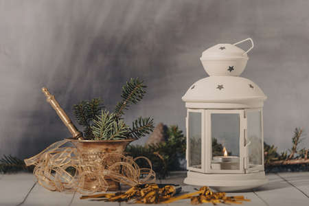 Composition of the Christmas decorations . Bright ornaments, hand lantern and spruce branches isolated on white background. Wide photo.の写真素材