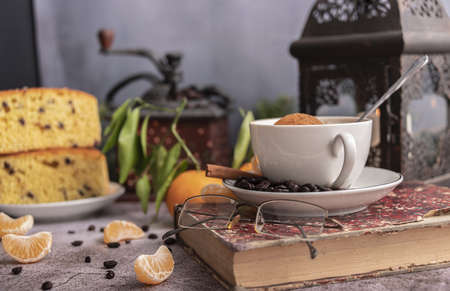 Morning breakfast.Still life with coffe, cakes, cinnamon, nuts and branches of spruce.の写真素材