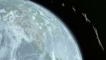Several cubesat is above the Earth and is orbiting the planet. 3d rendering.の写真素材