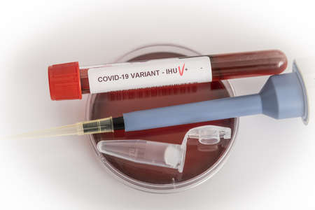 Blood samples of the new variant IHU, covid19, coronavirus. Selective approach to the sample tube.の写真素材