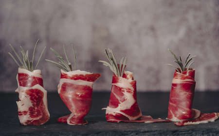 Spanish jamon Serrano, against a stone background.の写真素材