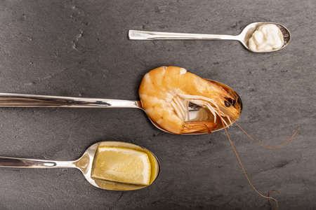 Roasted tails of shrimps with fresh rosemary and lemon.の写真素材