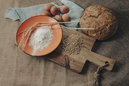 Fresh sourdough bread. Raw material for the production of fresh and homemade sliced bread.の写真素材