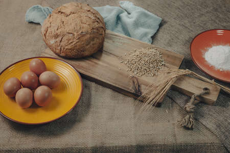 Fresh sourdough bread. Raw material for the production of fresh and homemade sliced bread.の写真素材