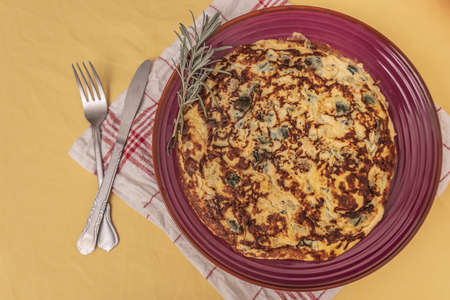 Tortilla, spanish omelet with fried potato and vegetables.の写真素材