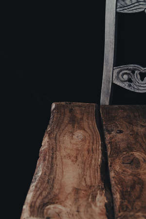 empty wooden table with smoke float up on dark background.の写真素材