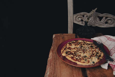 Tortilla, spanish omelet with fried potato and vegetables.の写真素材