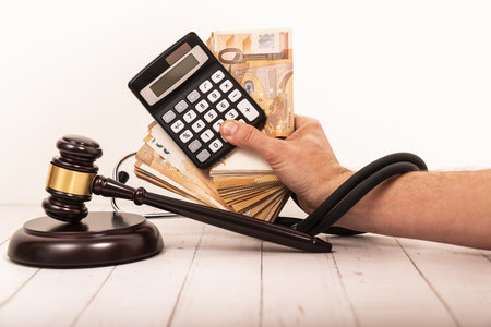 Top view image of gavel and stethoscope with Personal Injury Law wording. Law medical concept.の写真素材