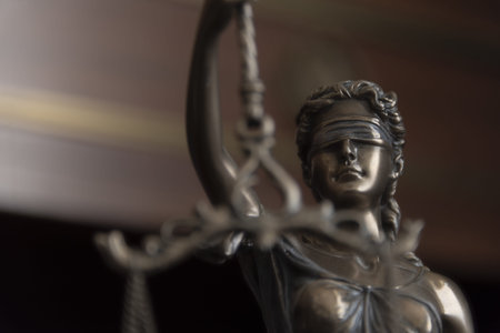 Law and judgment concept. Figure of Lady Justice in notary office close-up.の写真素材