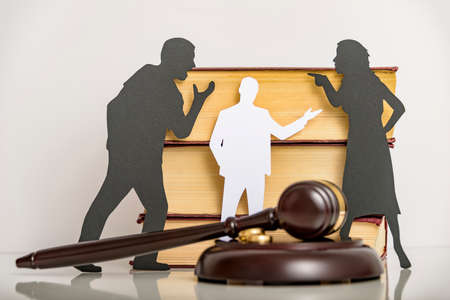 Silhouette symbol. Child custody. Family law proceedings. Divorce mediation, legal separation.の写真素材